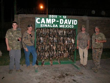 If you had a bad duck season and want some real duck hunting, come on down like this father and son group did.